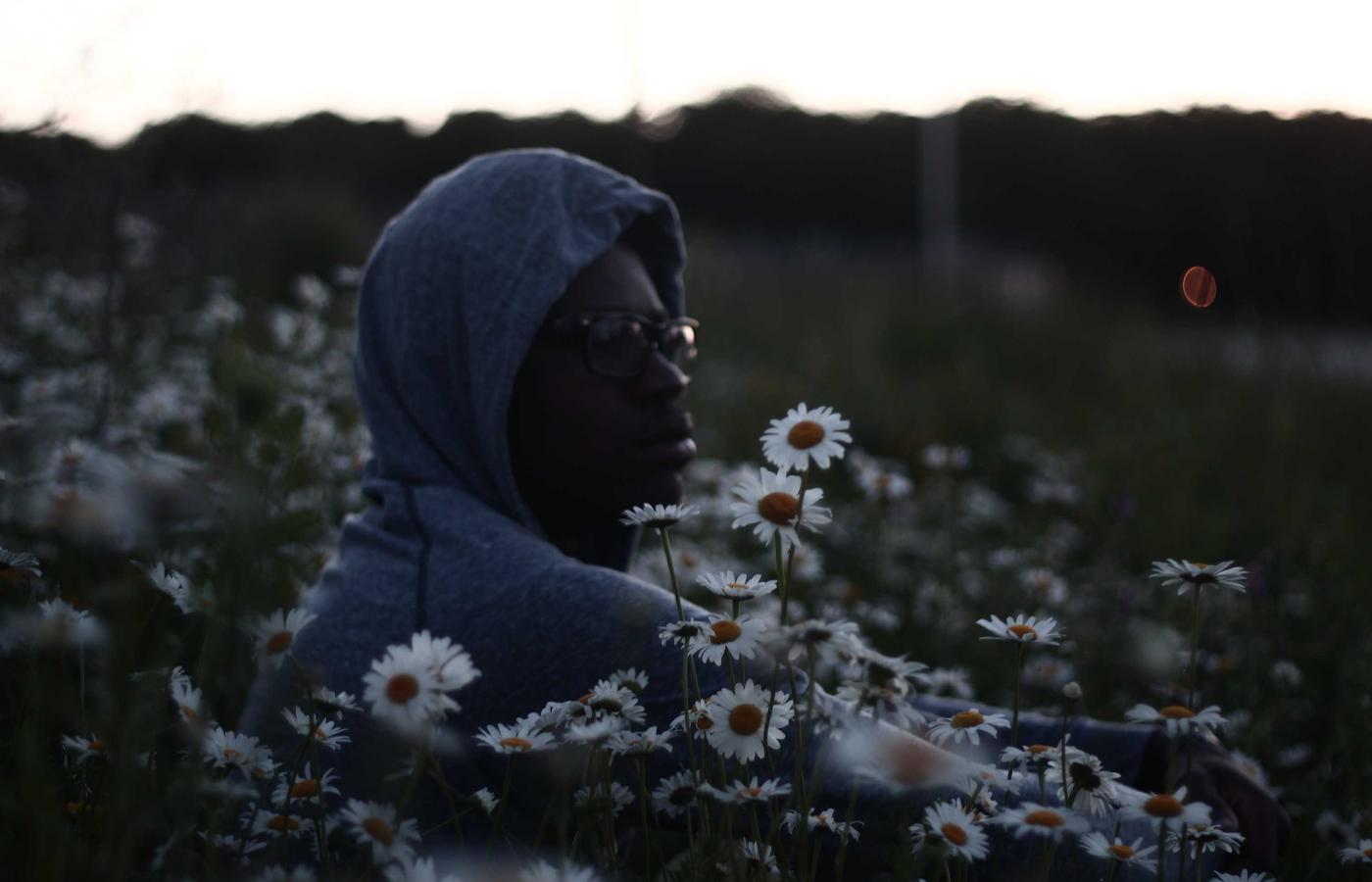 Two people having a discussion over a laptop